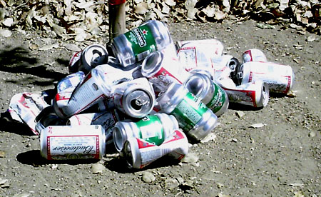 a pile of empty beer cans