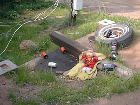 cabbage patch doll amidst used oil